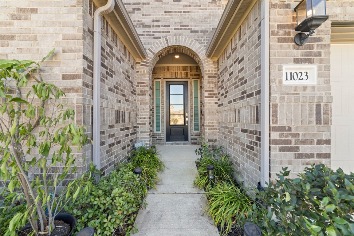 11023 Abendstern Road Tomball, TX 77375 - Photo 2 of 26 a front view of a brick house with a large windows
