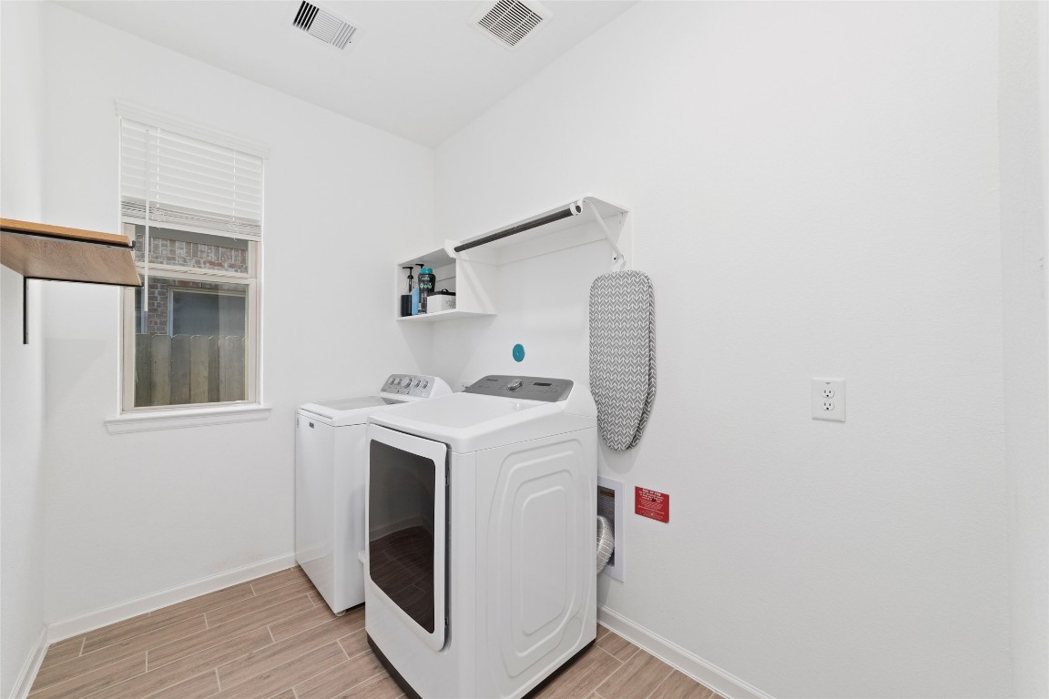 11023 Abendstern Road Tomball, TX 77375 - Photo 23 of 26 a utility room with dryer and washer
