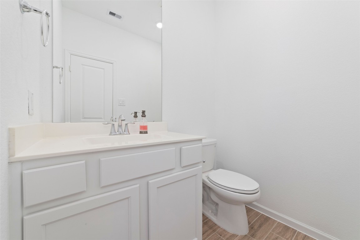 11023 Abendstern Road Tomball, TX 77375 - Photo 26 of 26 a bathroom with a sink a toilet and a mirror