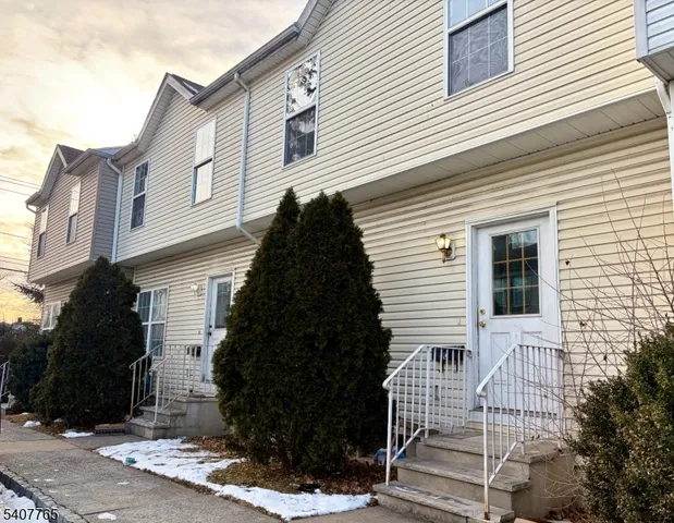 a view of a house with a tree