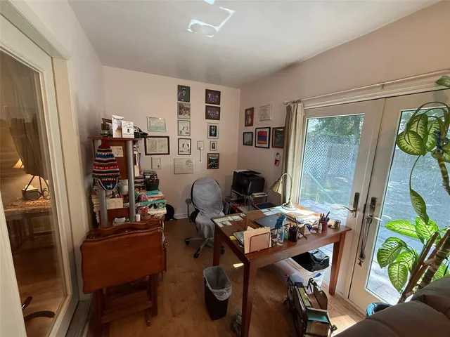 a work room with furniture and wooden floor