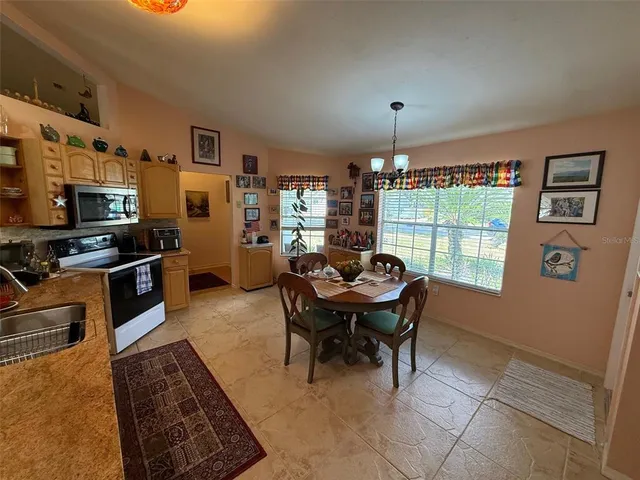 a workspace with furniture a rug and a window