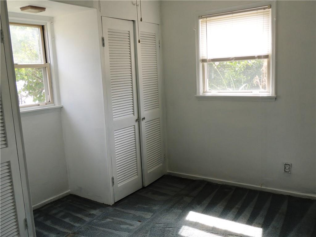 385 Rockhill Road Pittsburgh, PA 15243 - Photo 12 of 23 an empty room with wooden floor and windows