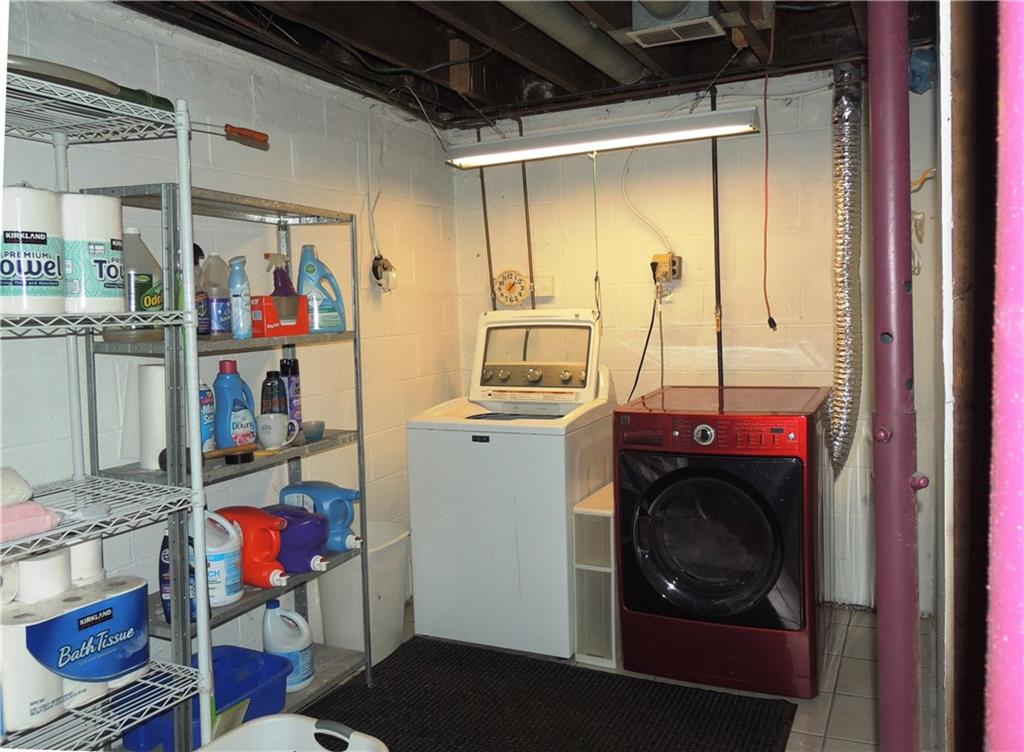 385 Rockhill Road Pittsburgh, PA 15243 - Photo 19 of 23 a utility room with dryer washer and shoe rack