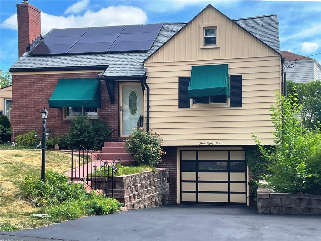 385 Rockhill Road Pittsburgh, PA 15243 - Photo 21 of 23 a front view of a house with a garden
