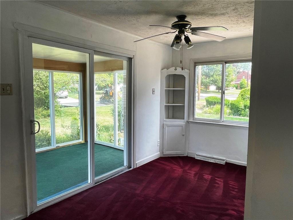 385 Rockhill Road Pittsburgh, PA 15243 - Photo 5 of 23 a view of empty room with a window and a ceiling fan