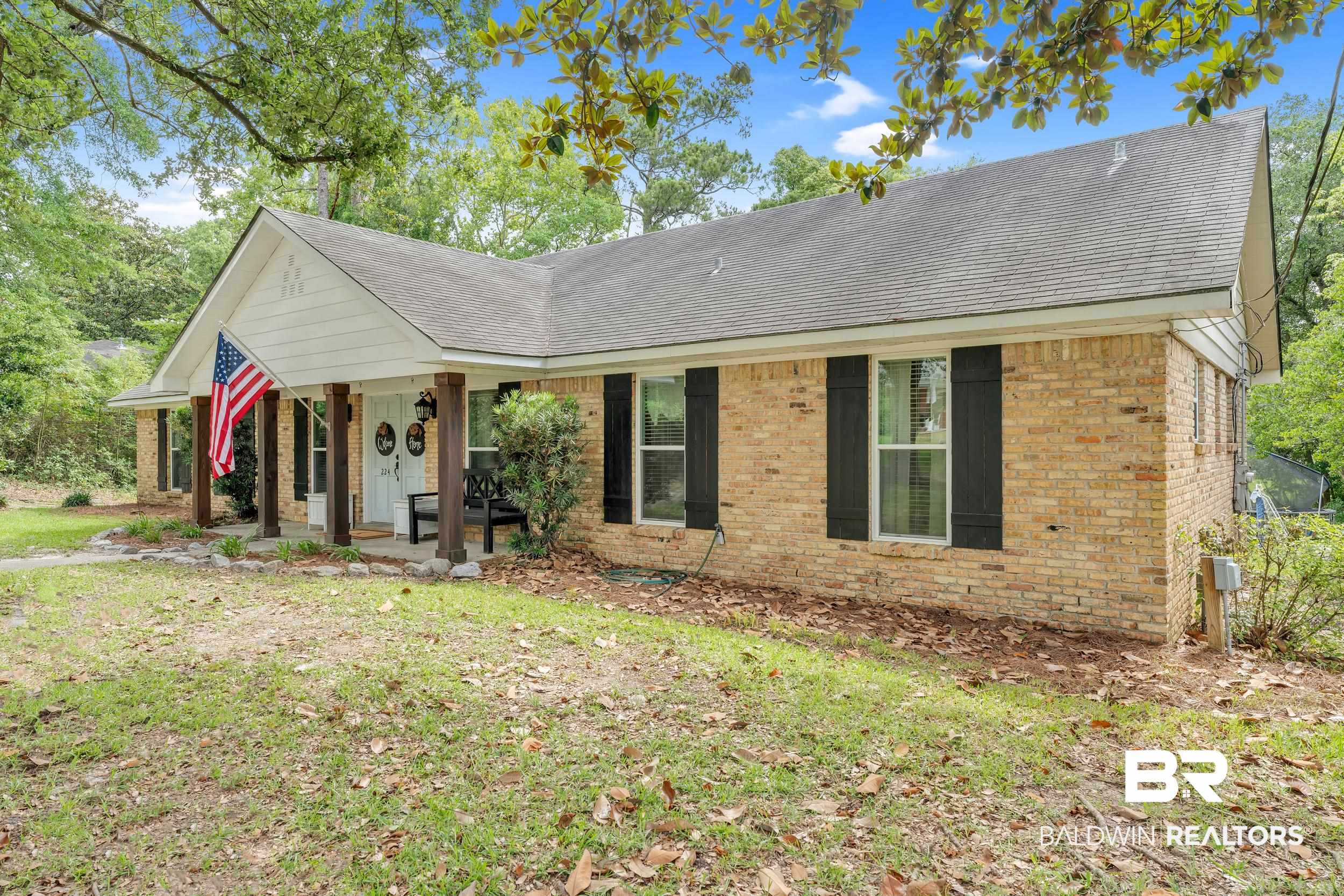 224 Cache Circle Mobile, AL 36611 - Photo 41 of 42 Ranch-style home with brick siding, covered porch, and roof with shingles