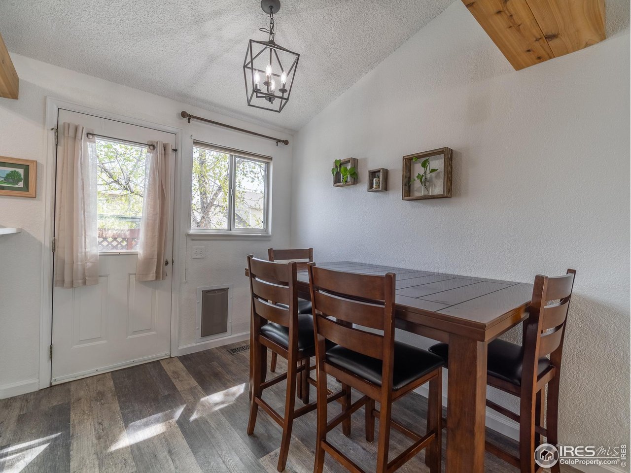 13146 Raritan Court Denver, CO 80234 - Photo 12 of 41 a view of a dining room with furniture and window