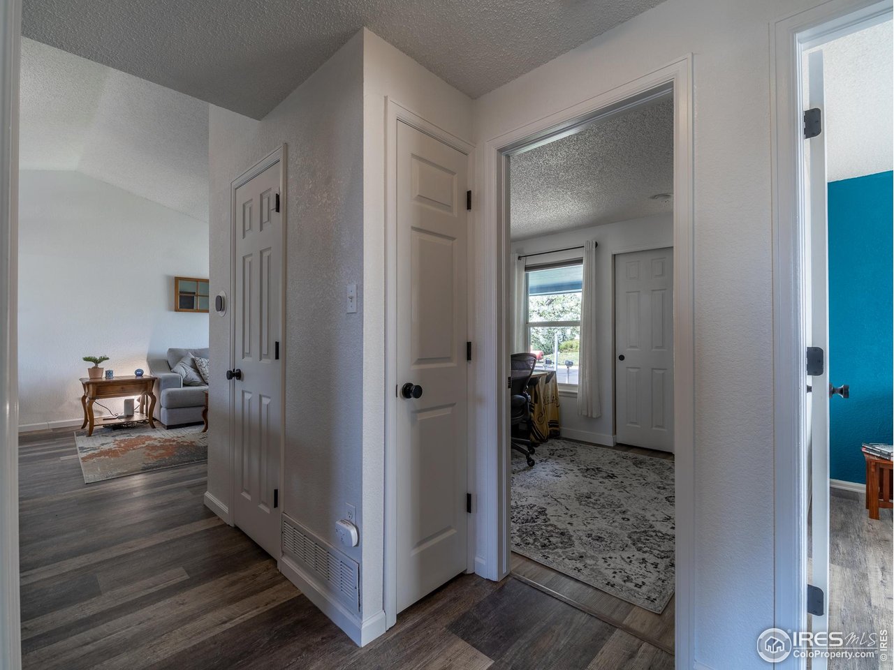 13146 Raritan Court Denver, CO 80234 - Photo 17 of 41 a view of a hallway with livingroom and a livingroom view