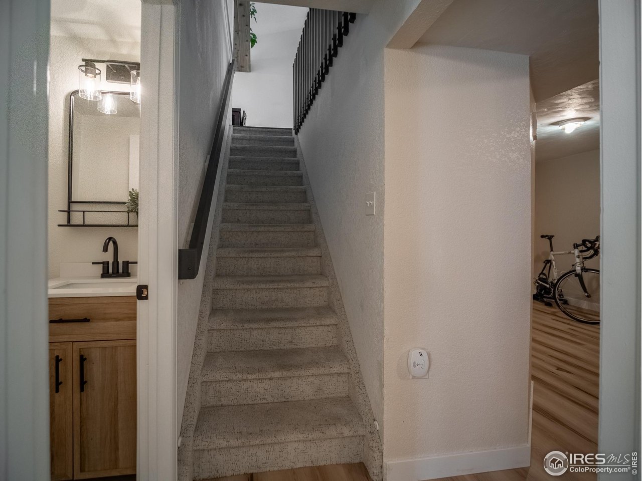 13146 Raritan Court Denver, CO 80234 - Photo 28 of 41 a view of a hallway with wooden floor and entryway