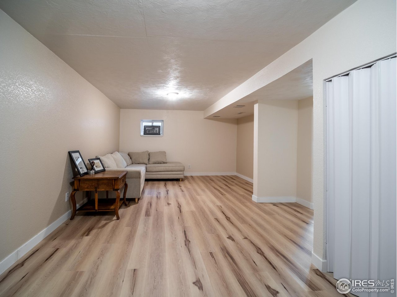 13146 Raritan Court Denver, CO 80234 - Photo 33 of 41 a view of a room with furniture and wooden floor