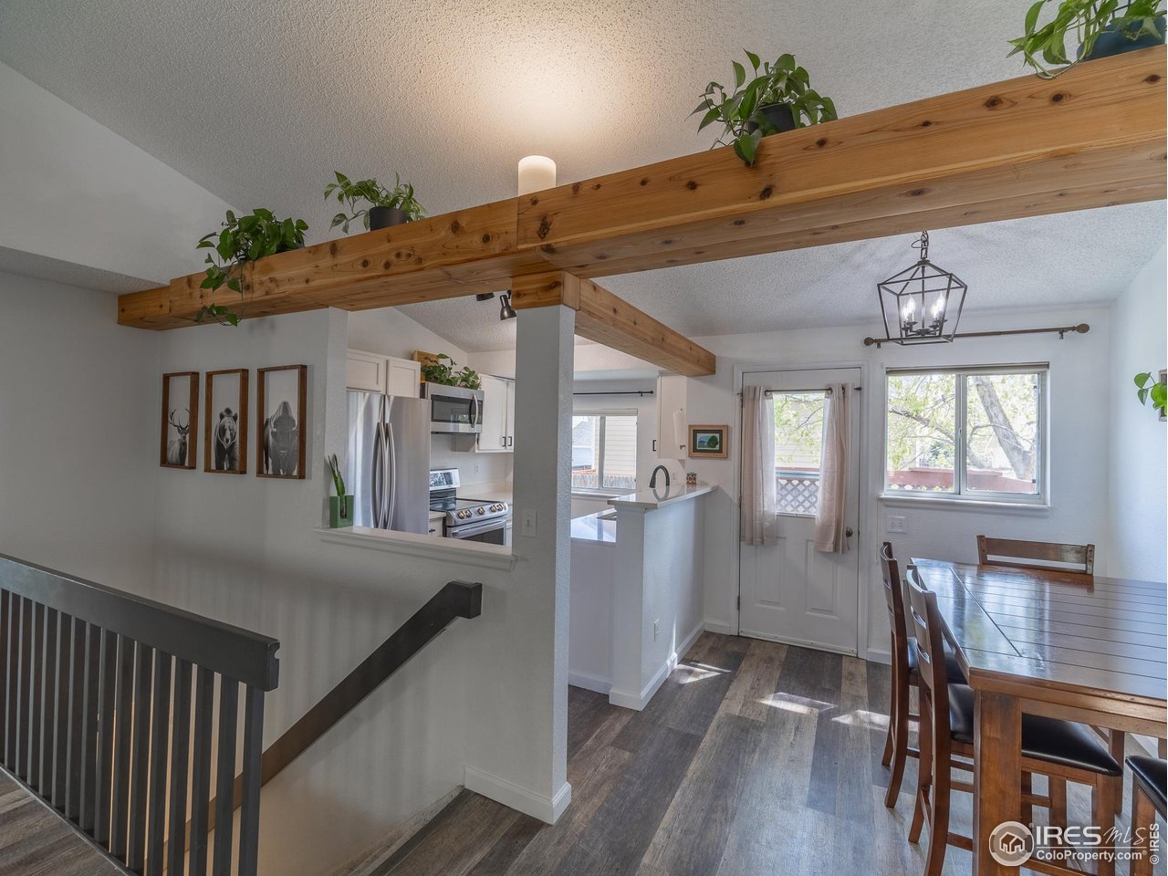 13146 Raritan Court Denver, CO 80234 - Photo 10 of 41 a view of a dining room with furniture window and wooden floor