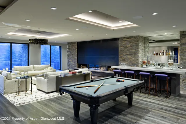 a kitchen with a table chairs and a view of kitchen