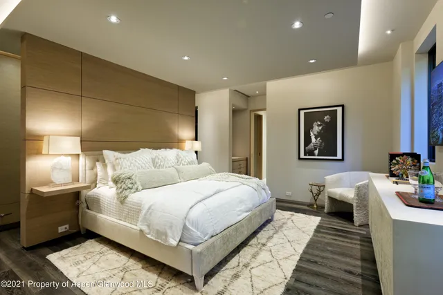 a bedroom with a bed and a couch