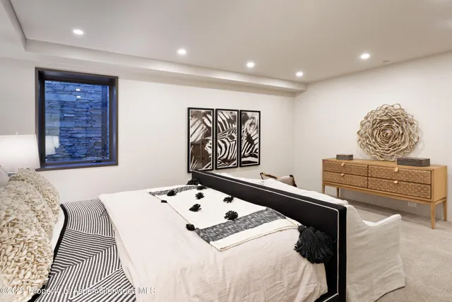 a bedroom with a bed and couch