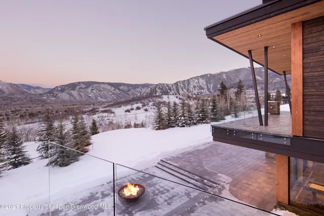 a view of a chairs and table in balcony