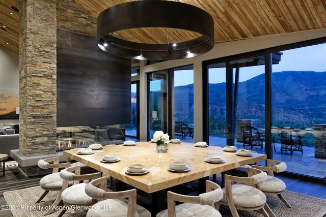 a view of an outside dining space with furniture