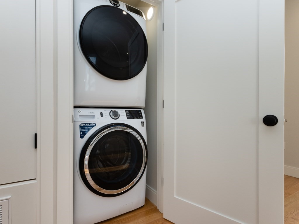 9 Tovar Street, Unit 2 Boston, MA 02122 - Photo 18 of 22 a utility room with dryer and washer