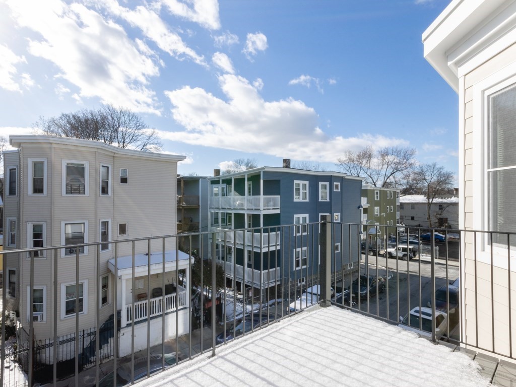 9 Tovar Street, Unit 2 Boston, MA 02122 - Photo 19 of 22 a view of buildings with glass windows