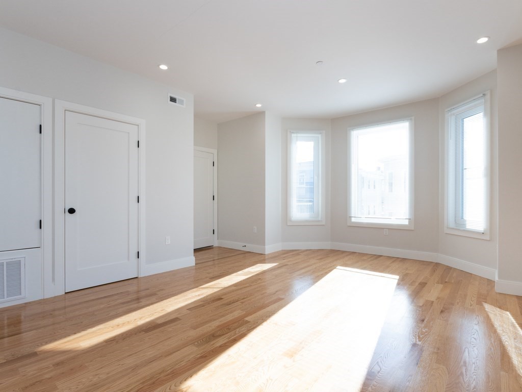 9 Tovar Street, Unit 2 Boston, MA 02122 - Photo 4 of 22 a view of an empty room and window