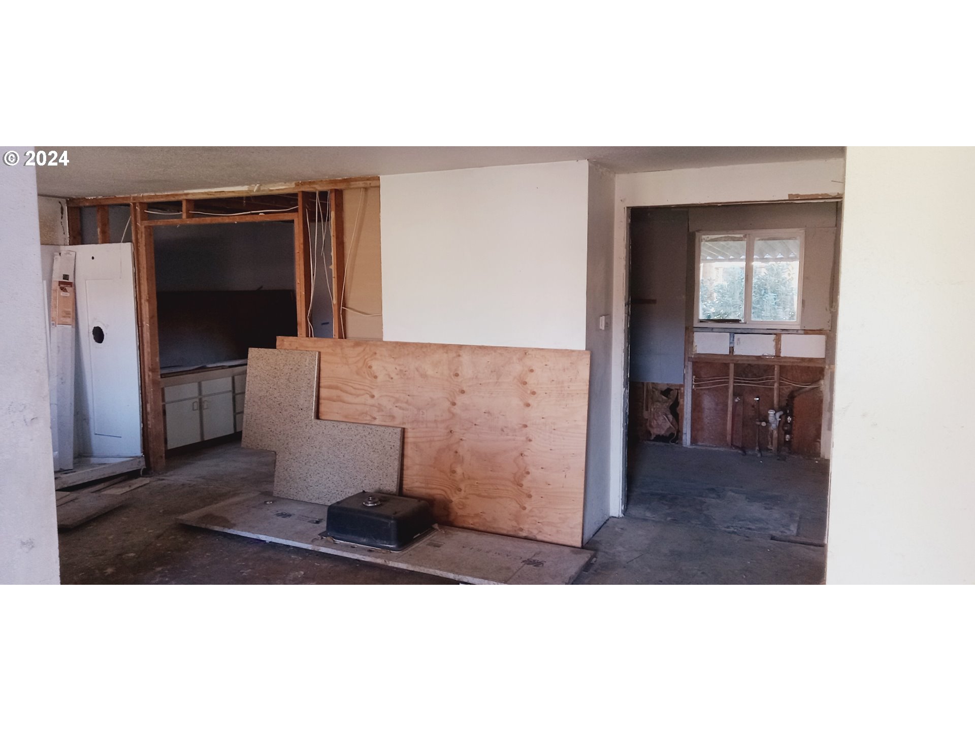 17126 Southeast Bush Street Portland, OR 97236 - Photo 14 of 17 a living room with a couch and a dining table