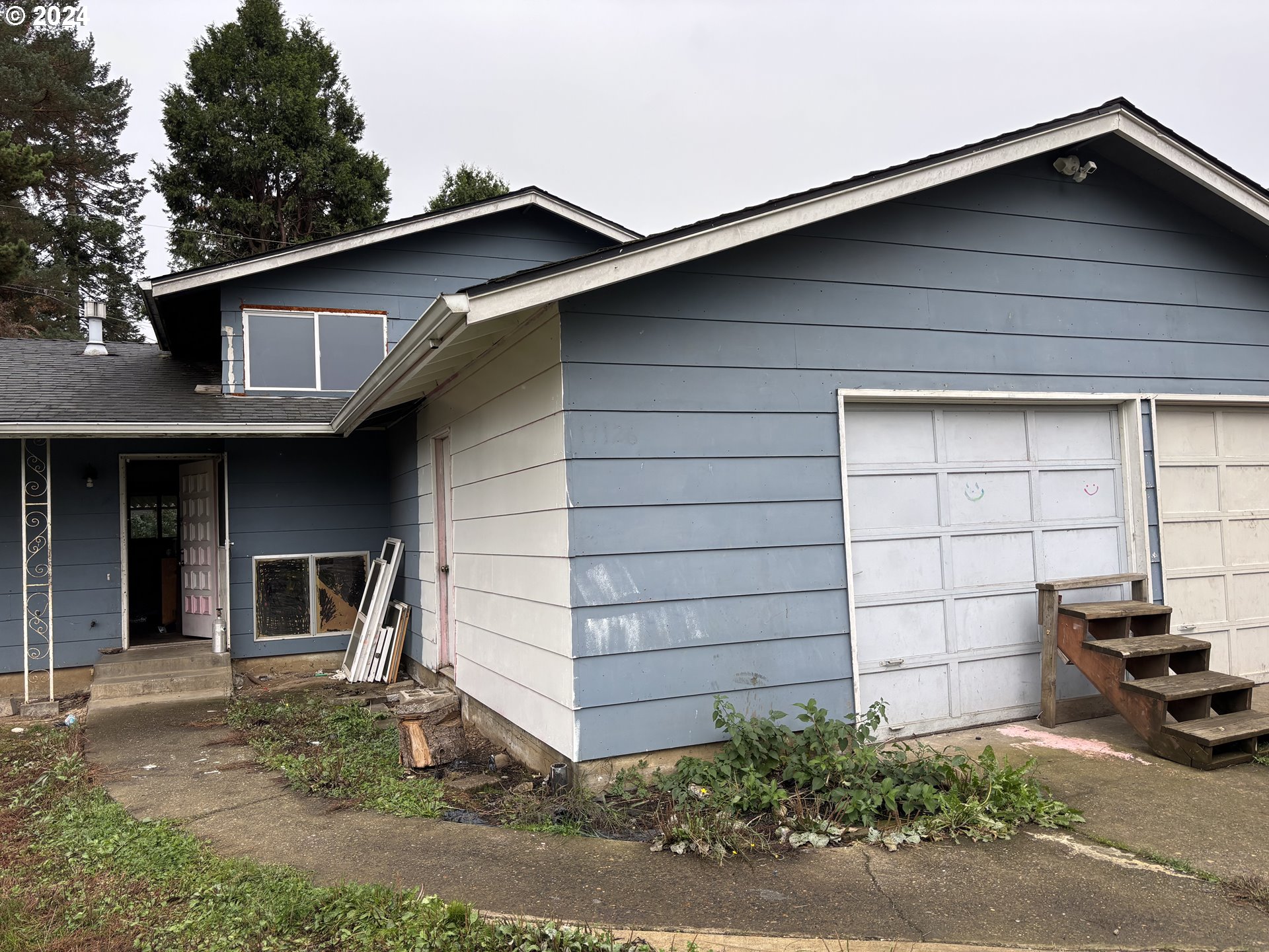 17126 Southeast Bush Street Portland, OR 97236 - Photo 2 of 17 a view of a house with a small yard and parking space