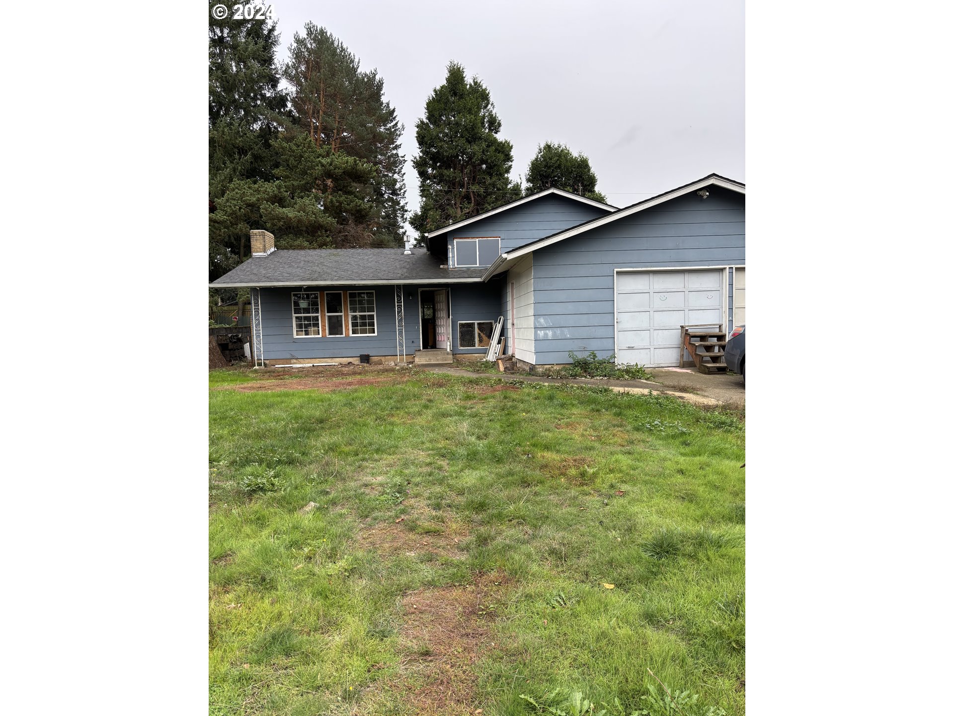 17126 Southeast Bush Street Portland, OR 97236 - Photo 4 of 17 a house view with a garden space