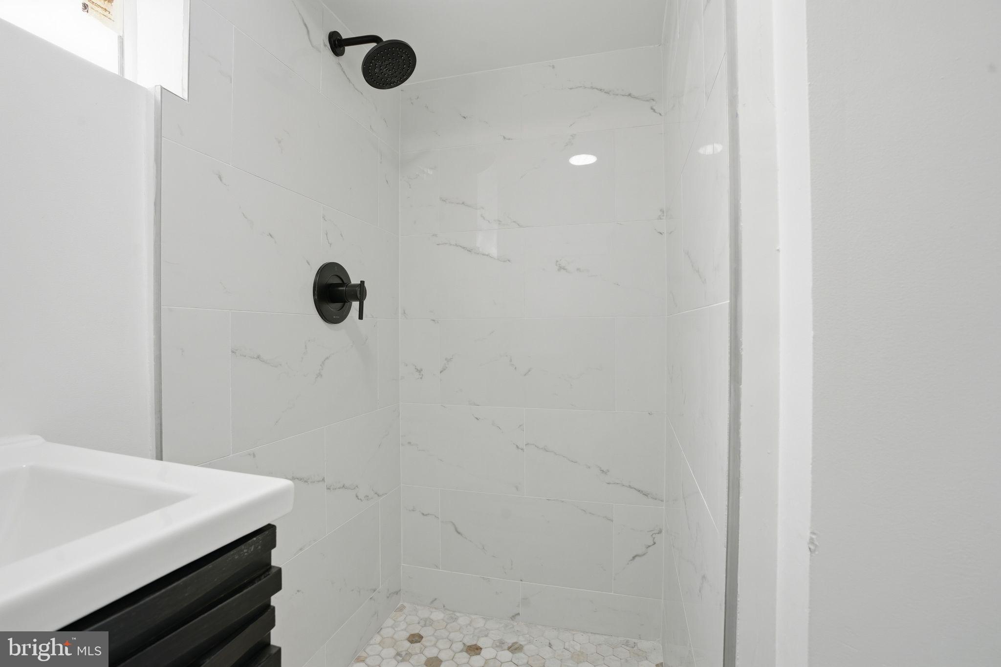 1208 Shepherd Street Northwest Washington, DC 20011 - Photo 16 of 27 a bathroom with a sink