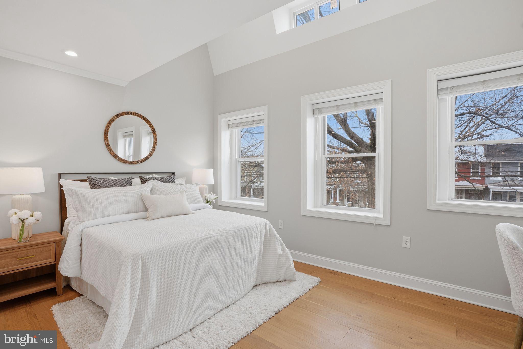 1208 Shepherd Street Northwest Washington, DC 20011 - Photo 17 of 27 a bedroom with a large bed and a window