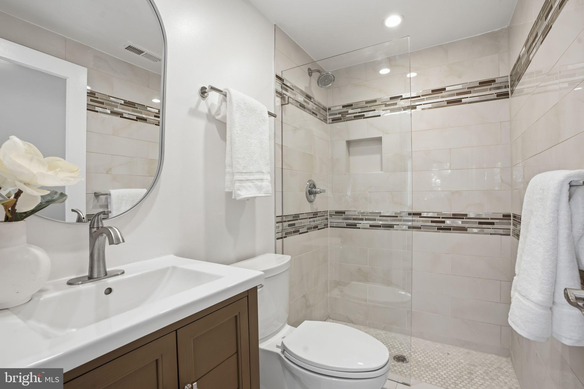 1208 Shepherd Street Northwest Washington, DC 20011 - Photo 20 of 27 a bathroom with a sink a toilet and shower