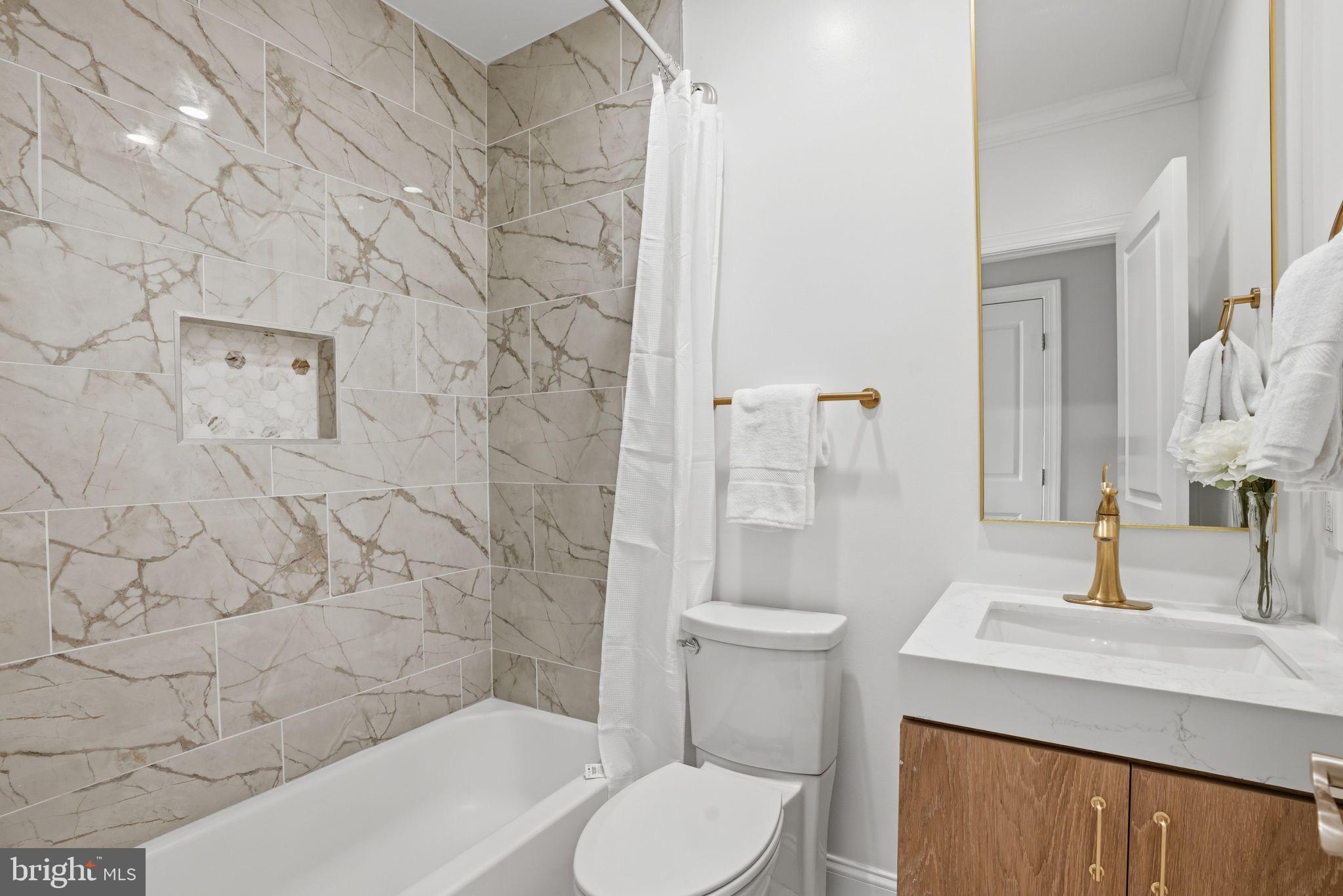 1208 Shepherd Street Northwest Washington, DC 20011 - Photo 23 of 27 a bathroom with a sink toilet and shower