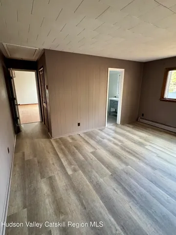 a view of an empty room and window