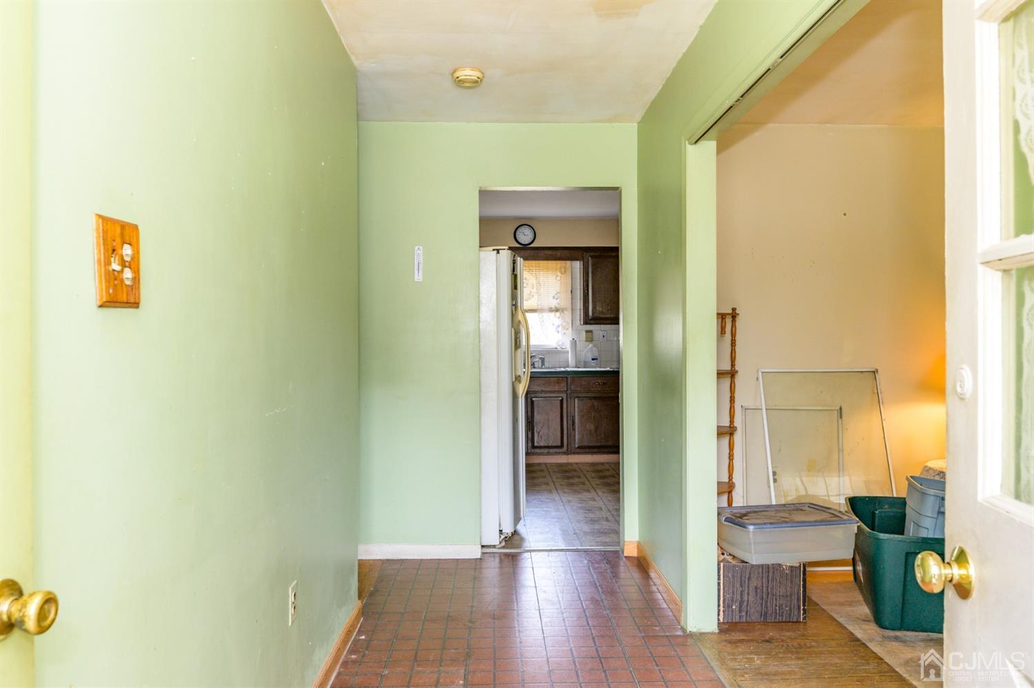 780 Monmouth Road Cream Ridge, NJ 08514 - Photo 3 of 35 a view of a hallway with wooden floor windows and livingroom