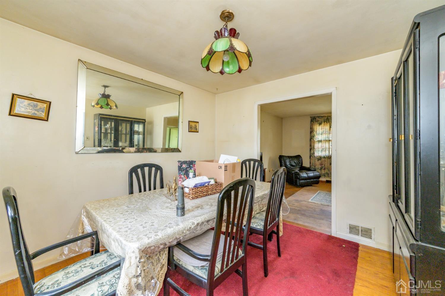 780 Monmouth Road Cream Ridge, NJ 08514 - Photo 8 of 35 a dining room with furniture and wooden floor