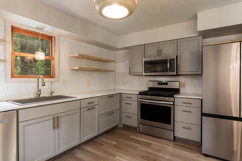 14 Terrace View Boulevard Oregon, IL 61061 - Photo 28 of 50 a kitchen with a sink stove and refrigerator