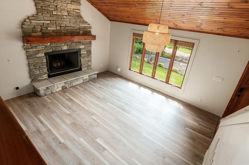 14 Terrace View Boulevard Oregon, IL 61061 - Photo 32 of 50 a view of an empty room with wooden floor fireplace and a window