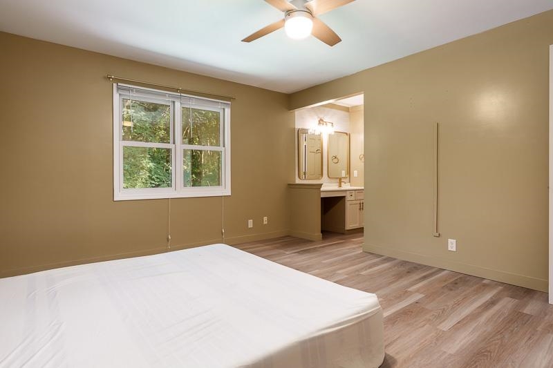 14 Terrace View Boulevard Oregon, IL 61061 - Photo 40 of 50 an empty room with a window and wooden floor