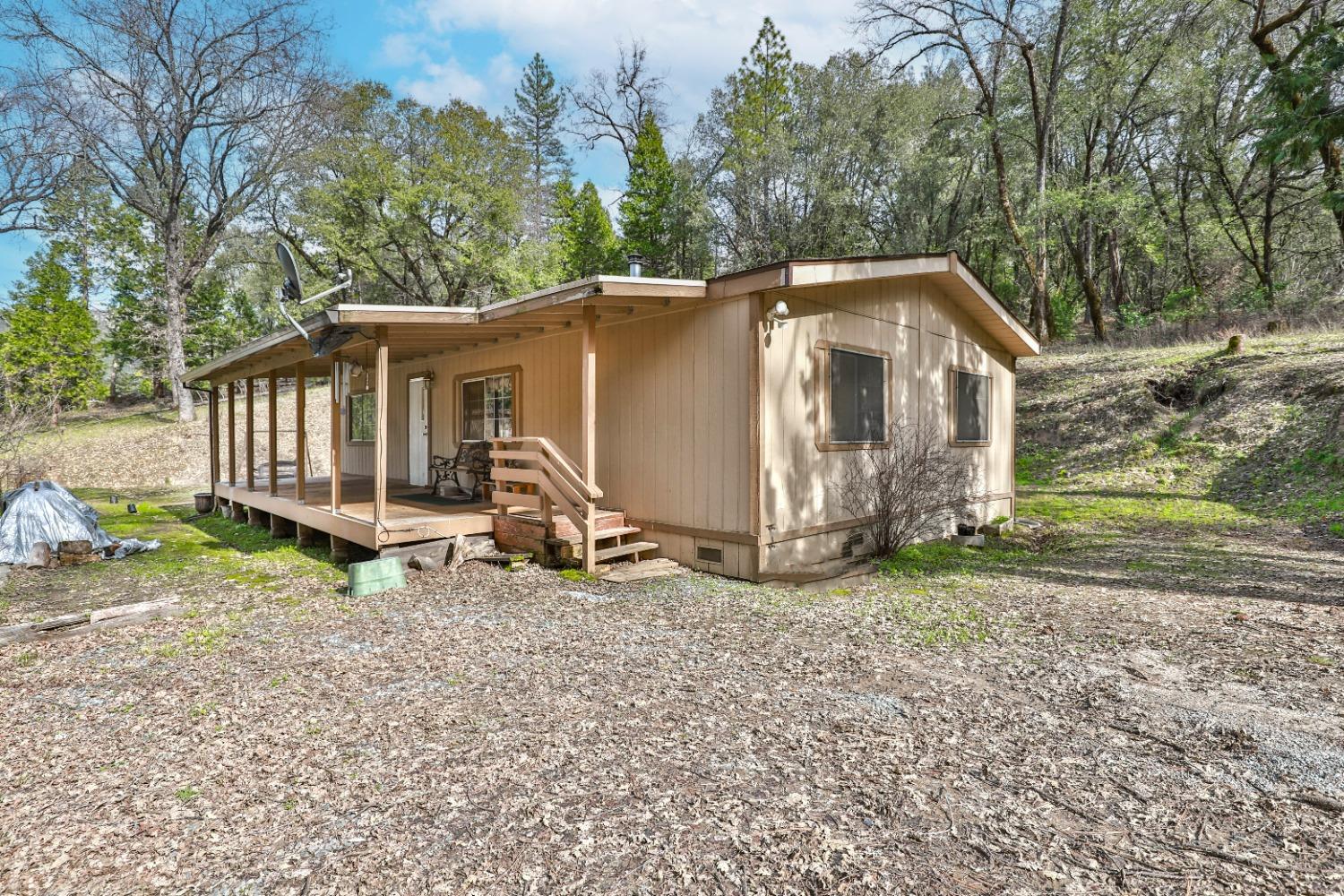 7277 Red Ant Road Somerset, CA 95684 - Photo 2 of 42 a view of a small house with a yard