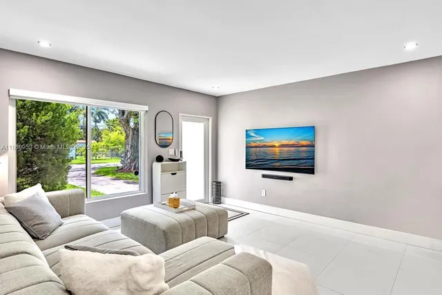 a kitchen with stainless steel appliances a refrigerator and a stove top oven