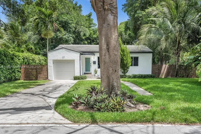 front view of a house with a yard