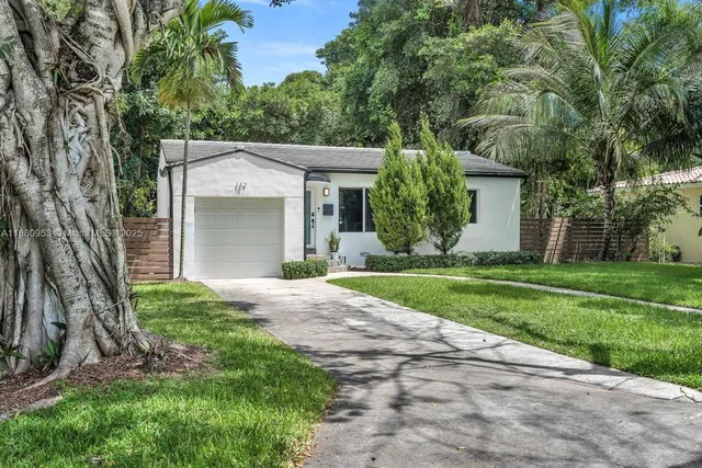 front view of a house with a yard