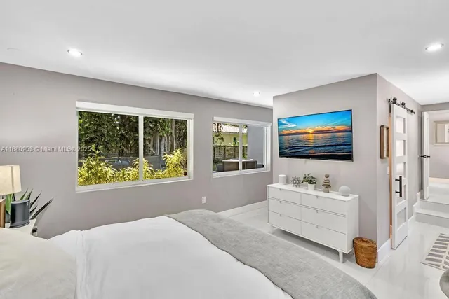 a backyard of a house with wooden floor yard and outdoor seating