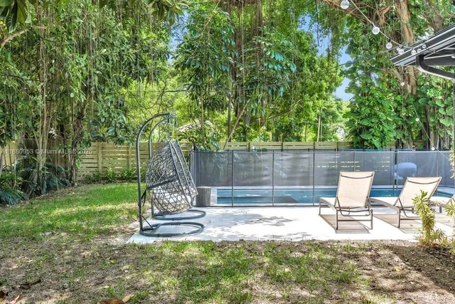 a outdoor living space with furniture and a potted plant