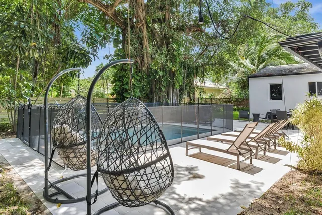 a backyard of a house with seating space