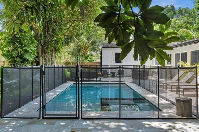 a view of a patio with table and chairs
