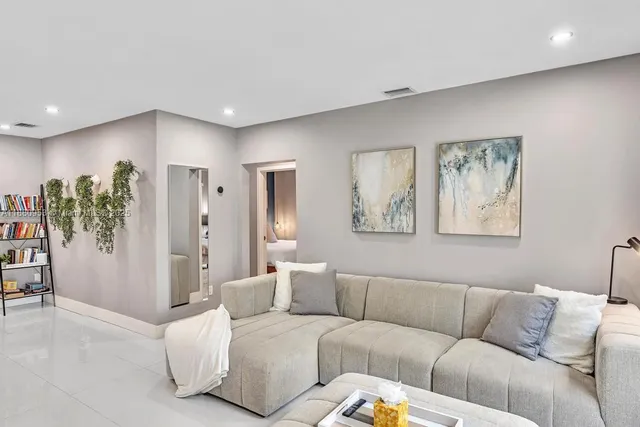 a living room with furniture and a window