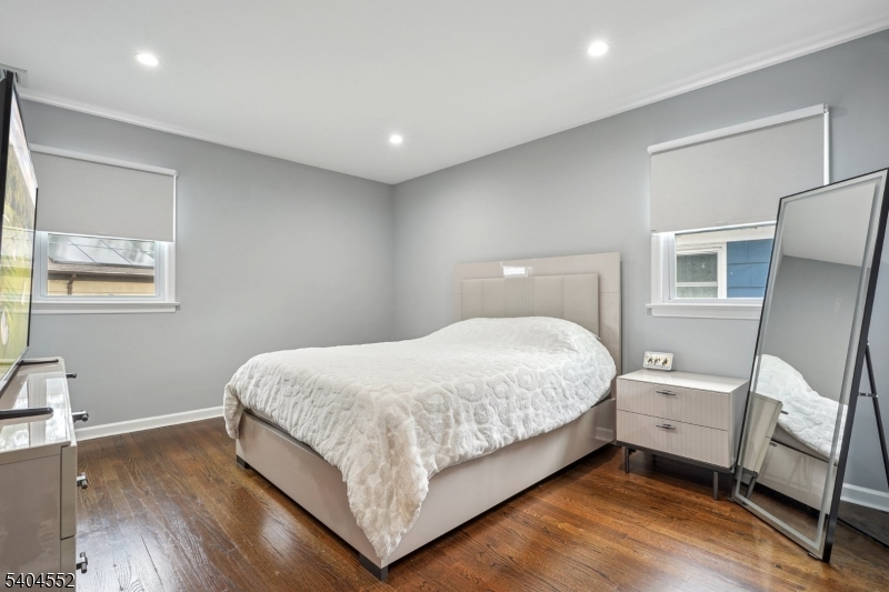 2389 Steuben Street Union, NJ 07083 - Photo 13 of 27 a bedroom with a bed and a night stand