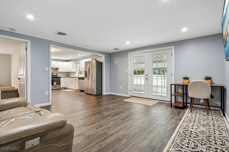 2389 Steuben Street Union, NJ 07083 - Photo 17 of 27 a living room with furniture and a table