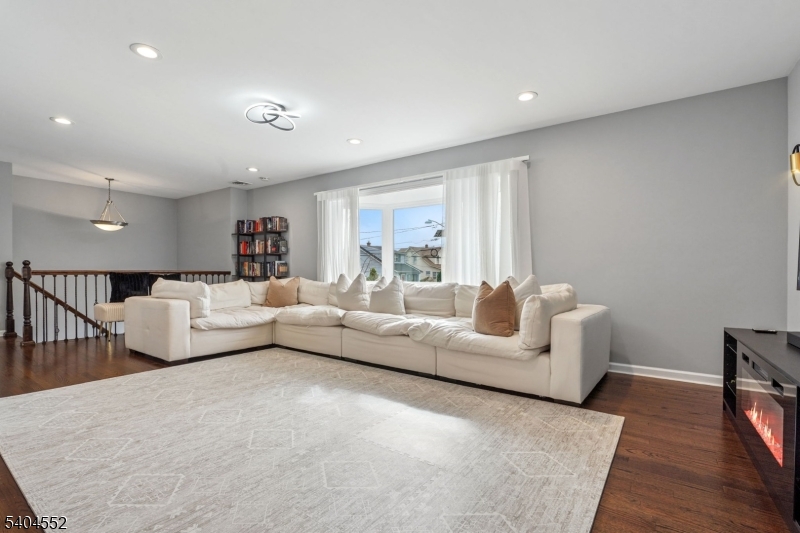 2389 Steuben Street Union, NJ 07083 - Photo 2 of 27 a living room with furniture and a large window
