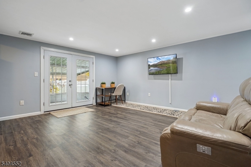 2389 Steuben Street Union, NJ 07083 - Photo 22 of 27 a living room with furniture and a flat screen tv